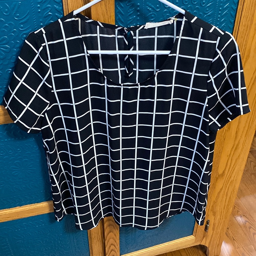 Short sleeve, light weight blouse. Black and cream check.